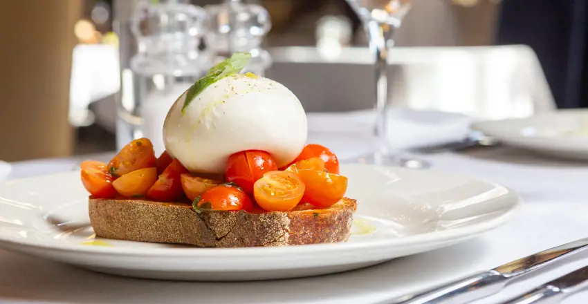 Burrata Bruschetta Burrata, marinated tomatoes, basil, olive oil on sourdough